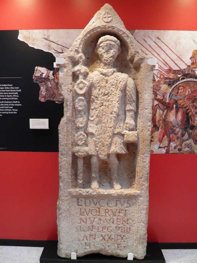 A Roman-era stone slab at the Yorkshire Museum, York, with an inscription below a carved figure of a signifer or standard bearer in the 9th Hispanic Legion